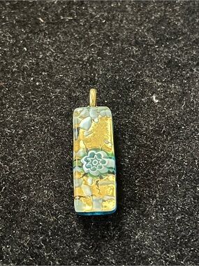 GlassOfVenice Murano glass stick pendant featuring a floral millefiori design.
